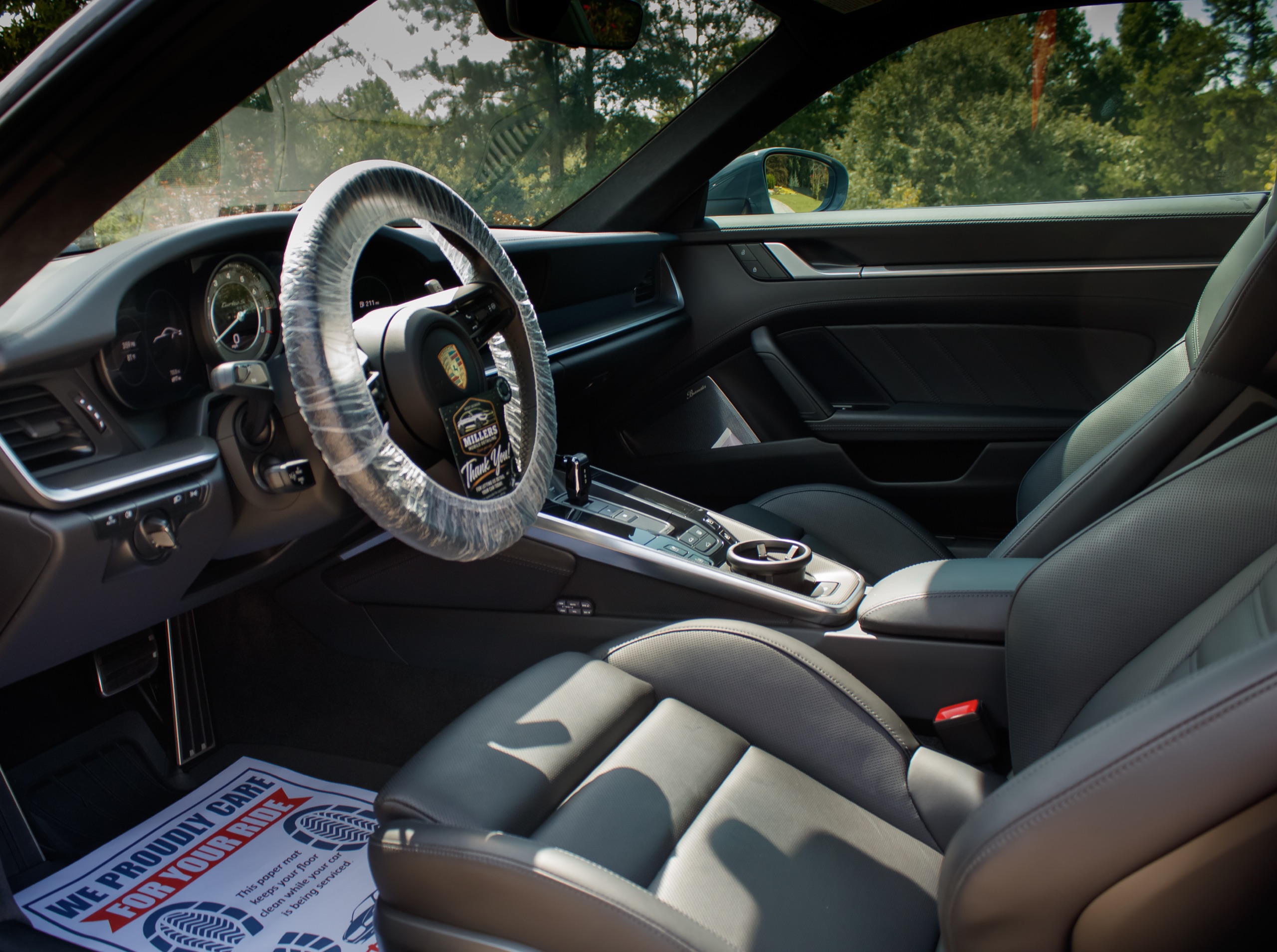 Black leather Porsche cabin after detailing